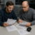Engineer reviewing a Custom Lens RFQ Checklist and lens drawings